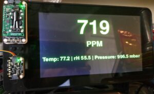 a 7-inch screen displays the output of a python script that reads data from CO2 and pressure sensors, and then displays that information on the screen.